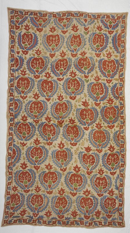 Quilt facing, or bedding, from the Ottoman empire embroidered with continuous patterns of the pomegranate motif. The pomegranates are faced with two large serrated leaves on either side of the fruit. This style of border is common among seventieth to eighteenth century Ottoman embroideries .